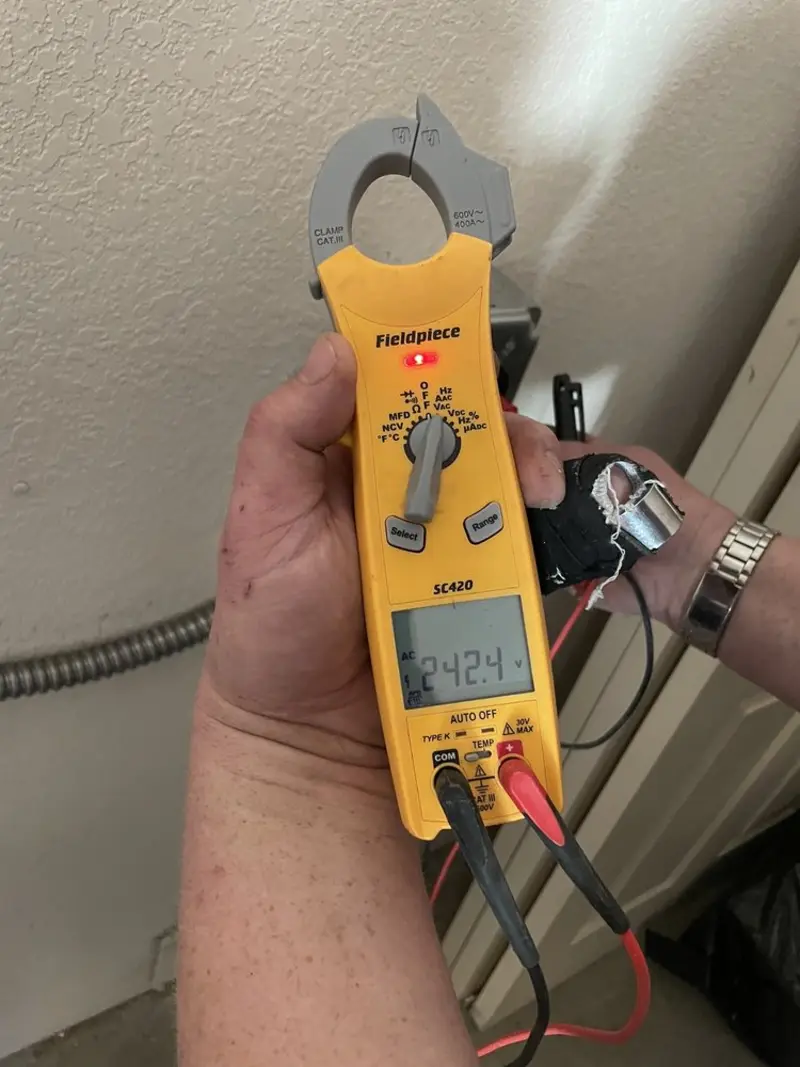Voltage testing with clamp meter during Generator Installation in Riley